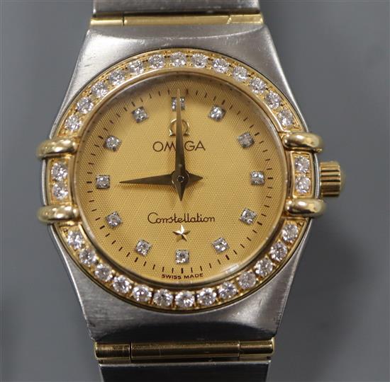 A ladys yellow metal, steel and diamond set Omega Constellation quartz wrist watch.